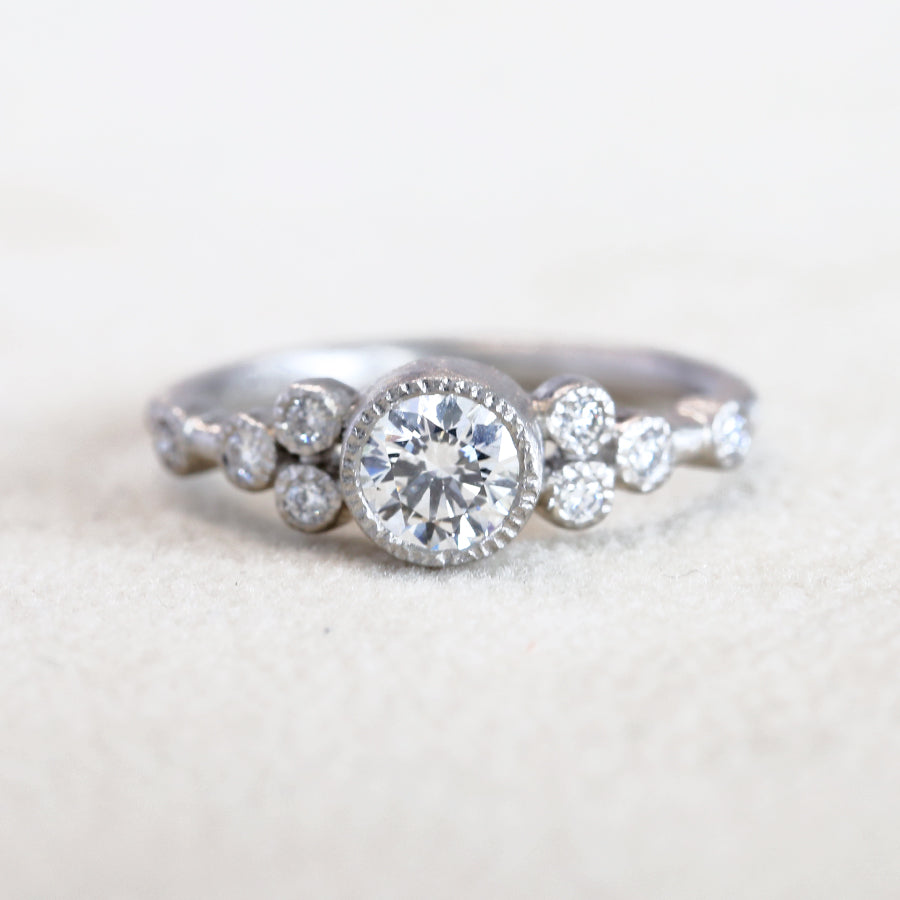 9 bezel diamond ring