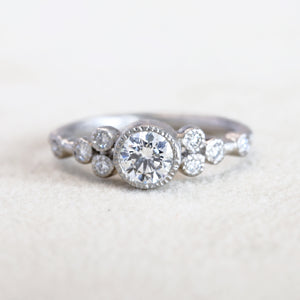 9 bezel diamond ring